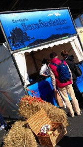 A customer  ordering a burger from on of the local producers