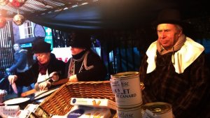 Guests from French town of Le Vésinet at their stall, serving the traditional French pancakes to freezing visitors 