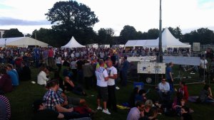 Public enjoying the last rays of sunshine with a glasses in their hands