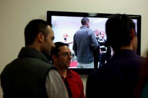 Gostra Man reflecting in the screen during reception