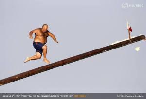 August 25, 2013 - Daniel Caruana (aka "Gostra Man") takes part in the gostra competition in the village of St Julians, Malta