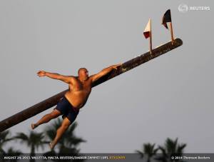 August 24, 2013 - Daniel Caruana (aka "Gostra Man") takes part in the gostra competition in the village of St Julians, Malta
