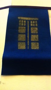 Golden Tardis on  bunting  decorating the main hall