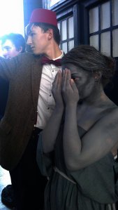 Weeping Angel covers her face and the Eleventh Doctor