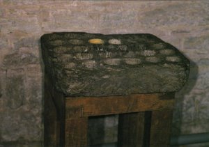 Brecon Cathedral - The Cresset Stone - a medieval vessel to contain flammable material to provide light. Photography by R.J.L Smith. Used with permission