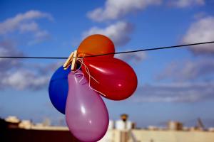 We have enough balloons to decorate the whole ethnic market. Actually, we may just do that.
