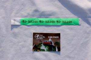Arm wristband and a car pass given to the exhibitors