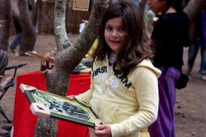 Sam holding a framed picture of Tera, our mom's first beloved black cat!