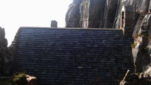 The slate roof is a modern addition to protect the ancient building