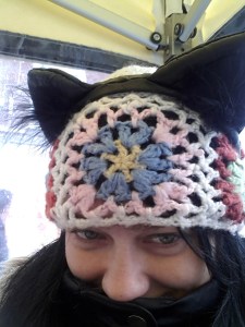 Malicia as a black cat in a hat.